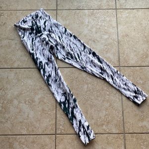Black and white work out pants with zipper ankle detail